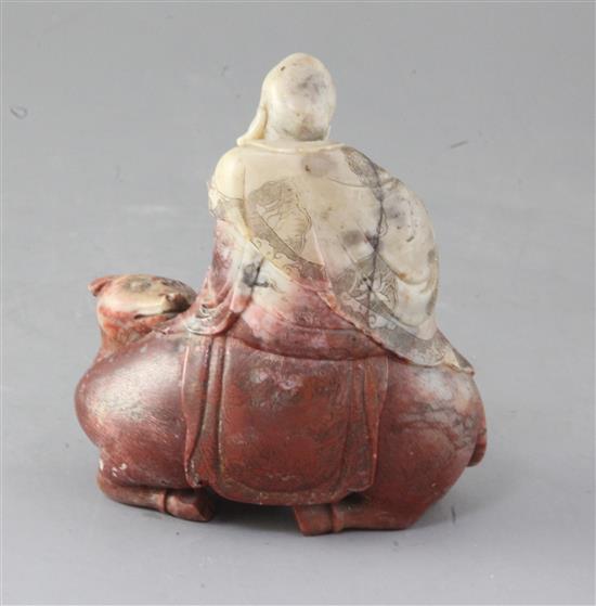 A Chinese chickens blood soapstone group of Shaolao riding a buffalo, 18th century, 13cm high, 12cm long, small losses